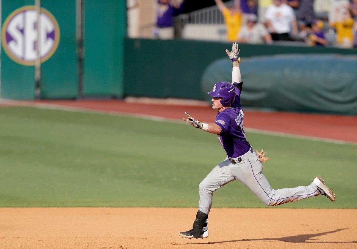 LSU's Greg Deichmann (7) celebrates after hitting a two-run home run against Rice in the seventh inning of an NCAA college baseball tournament regional game in Baton Rouge, La., Tuesday, June 7, 2016. LSU won 5-2 to advance to the super regionals. (Brett Duke/NOLA.com The Times-Picayune via AP) /NOLA.com The Times-Picayune via AP) MAGS OUT; NO SALES; USA TODAY OUT; THE BATON ROUGE ADVOCATE OUT; THE NEW ORLEANS ADVOCATE OUT; MANDATORY CREDIT