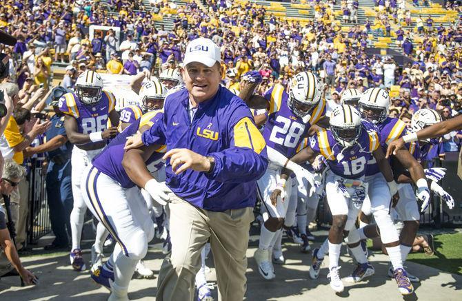 <p>LSU head coach Les Miles leads his team toward the field before the Tigers’ 45-24 victory against the University of South Carolina on Saturday, Oct. 10, 2015 in Tiger Stadium.</p>