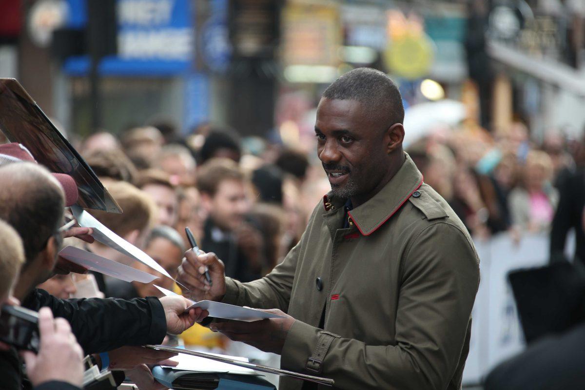 Actor Idris Elba signs autographs upon arrival at the premiere of the film 'Star Trek Beyond' in London, Tuesday, July 12, 2016. (Photo by Joel Ryan/Invision/AP)