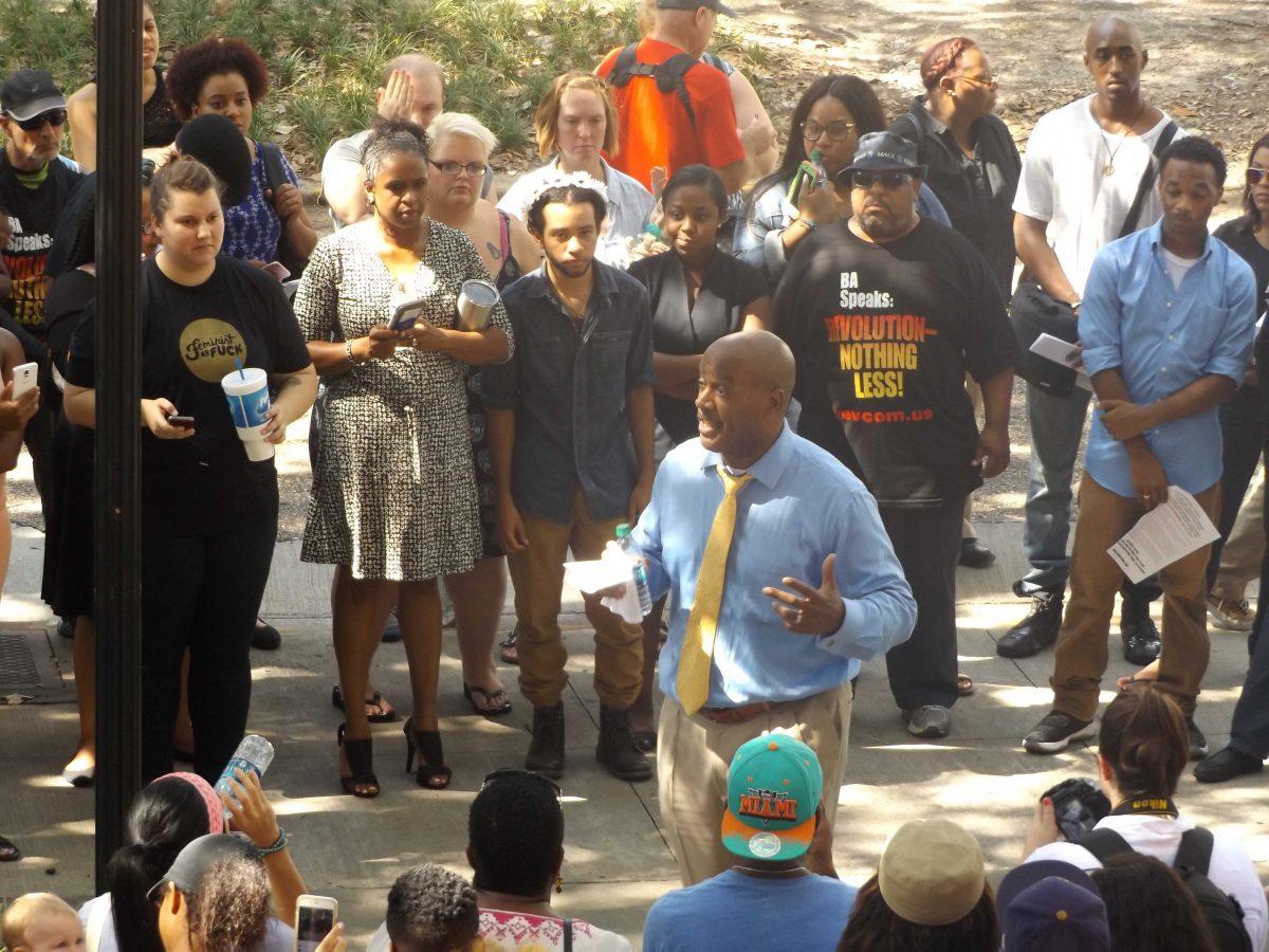 Vice Provost of Diversity and Chief Diversity Officer Dereck J. Rovaris speaks to a crowd outside the LSU African American Cultural Center on Thursday, July 7, before they made signs for an upcoming protest against the shooting of Alton Sterling by BRPD police officers.