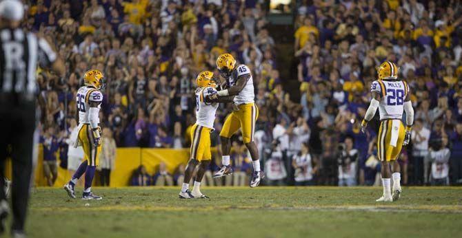 LSU sophomore tight end Josh Tharp (45) and junior corner back Tre&#8217;Davious White (18) celebrate after another incomplete pass by Florida in the last seconds of the game during the LSU 35-28 victory against the Gators on Saturday Oct. 17, 2015, in Tiger Stadium on LSU's campus.