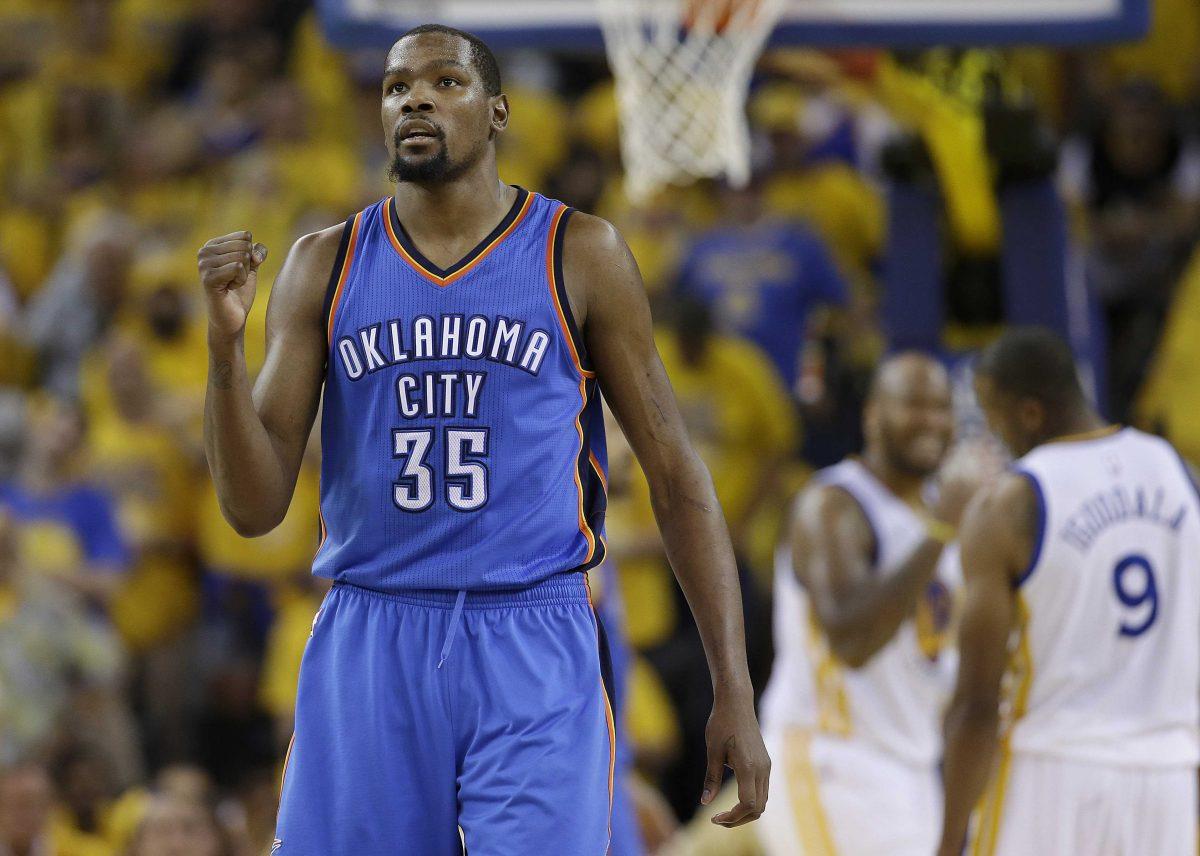 FILE - In a Monday, May 30, 2016 file photo, Oklahoma City Thunder forward Kevin Durant (35) reacts during the second half of Game 7 of the NBA basketball Western Conference finals against the Golden State Warriors in Oakland, Calif. Durant announced Monday, July 4, 2016, that he is joining All-Stars Stephen Curry and Klay Thompson with the Golden State Warriors. Durant made the decision public on The Players&#8217; Tribune Monday morning. He can&#8217;t officially sign until July 7. (AP Photo/Marcio Jose Sanchez, File)