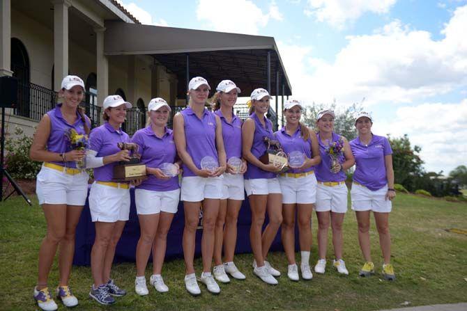 LSU lady tigers golf team hold the trophies for their win at the University Club on sunday March 29, 2015 during the Tiger Classic Tournament.