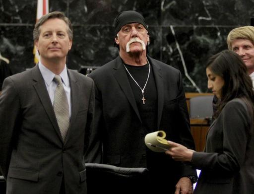 In this Monday, March 21, 2016, file photo, Hulk Hogan, whose given name is Terry Bollea, center, looks on in court moments after a jury returned its decision in St. Petersburg, Fla.