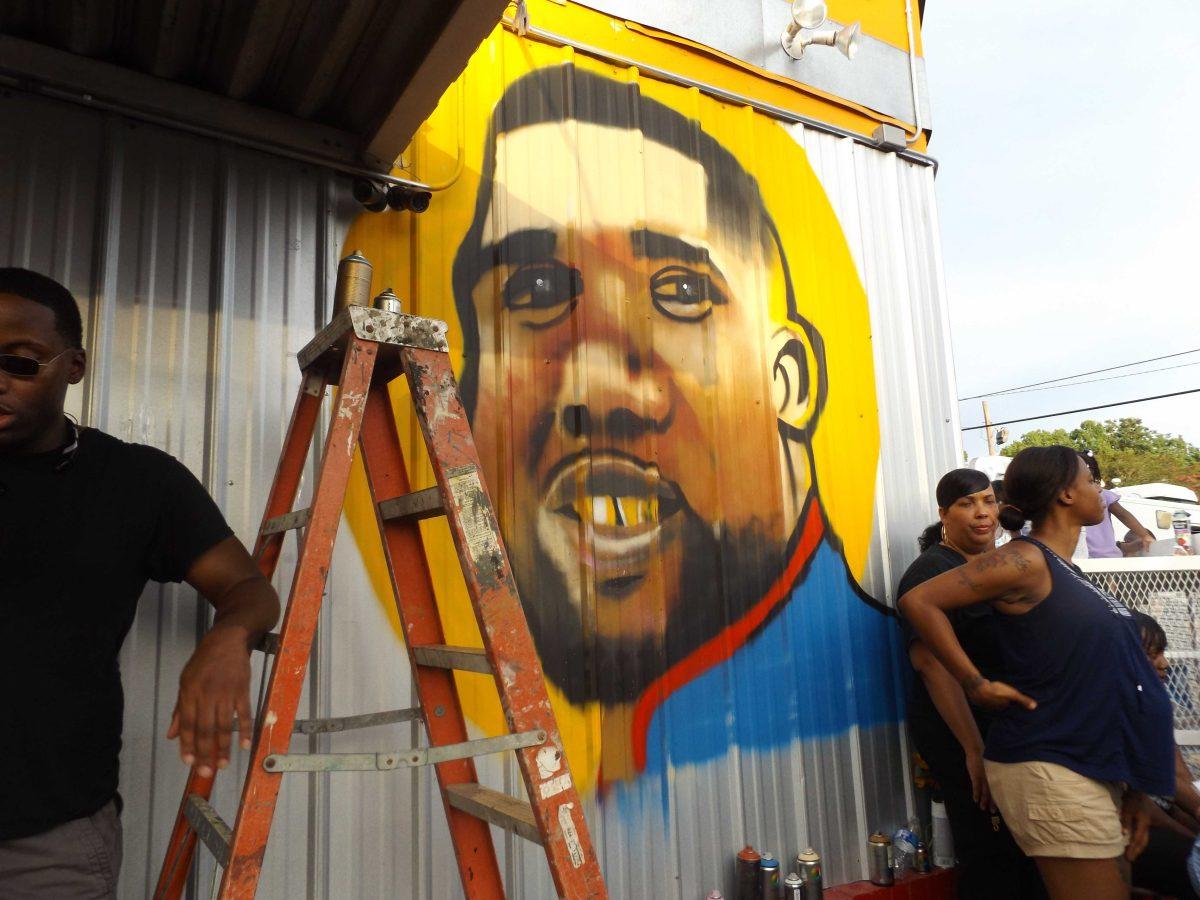 Protesters painted a mural honoring Alton Sterling, Wednesday, July 6, outside the&#160;Triple S Food Mart, where Sterling was fatally shot by police officers early Tuesday morning.&#160;