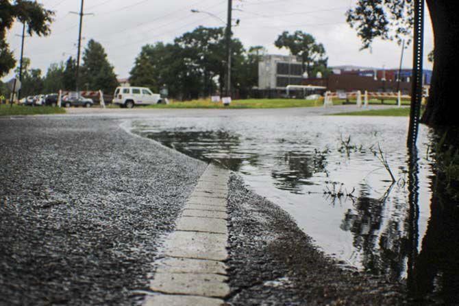 Flooding near Campus Drive makes its way into the streets on Saturday, Aug. 13, 2016, around LSU campus.