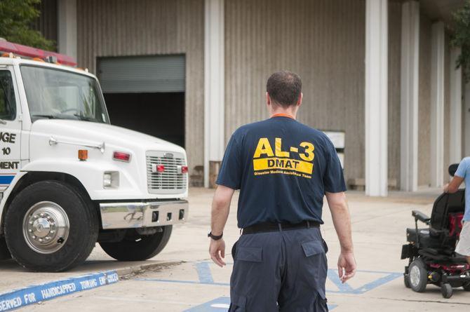 Residential assistants assist in setting up special needs shelter on campus