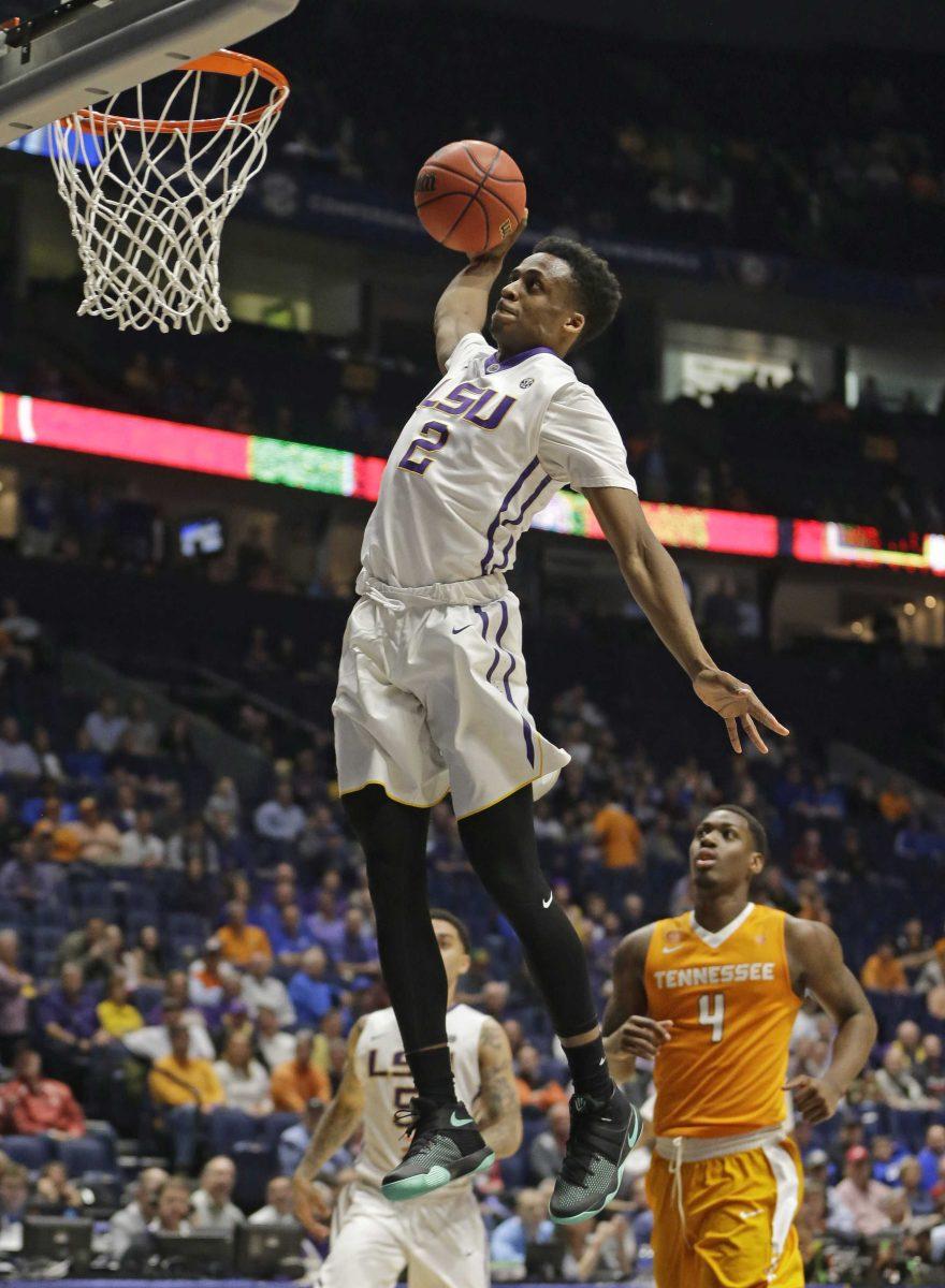 LSU's Antonio Blakeney (2) dunks as Tennessee's Armani Moore (4) looks on during the second half of an NCAA college basketball game in the Southeastern Conference tournament in Nashville, Tenn., Friday, March 11, 2016. LSU won 84-75. (AP Photo/Mark Humphrey)