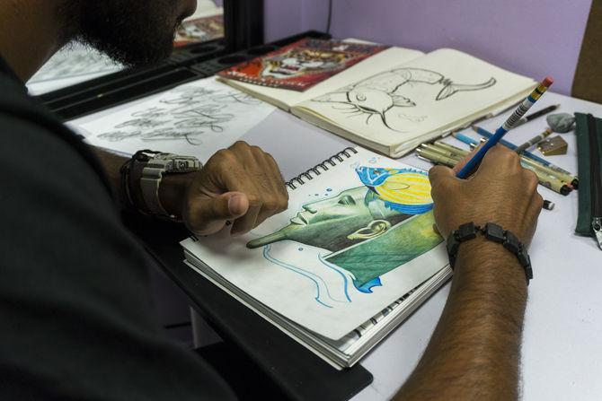 Local Baton Rouge tattoo artist Joseph Hines showcases some original designs at Art Addiction Tattoo Studio.