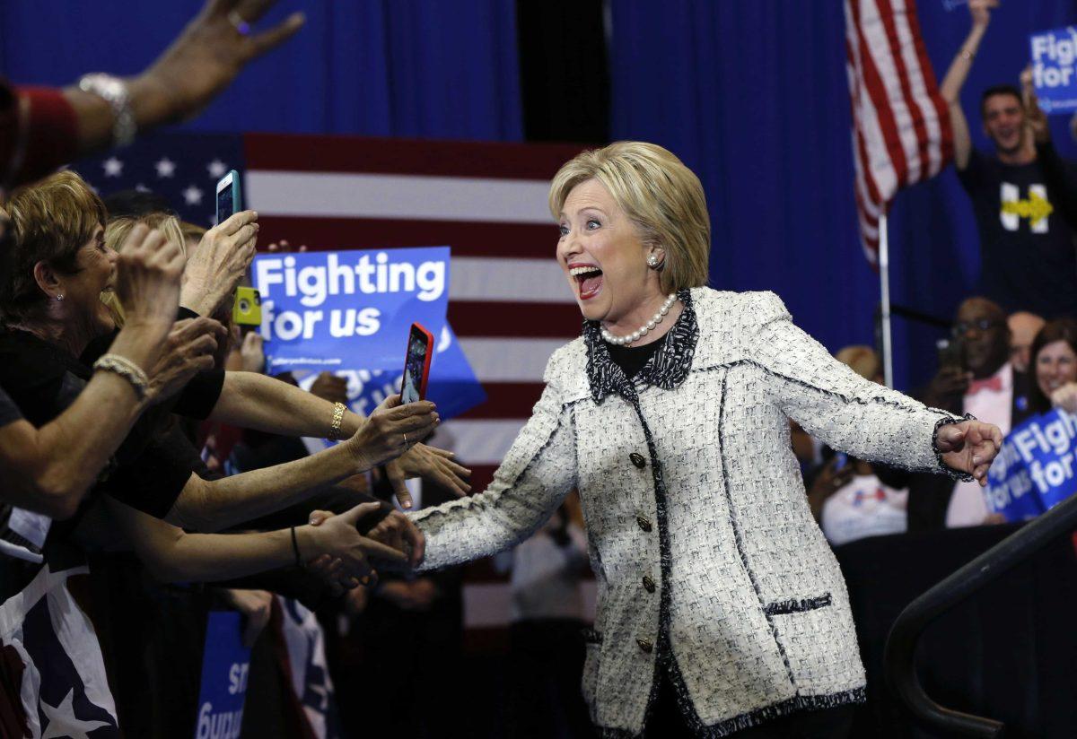 Democratic presidential candidate Hillary Clinton greets supporters as she arrives to speak to supporters at her election night watch party for the South Carolina Democratic primary in Columbia, S.C., Saturday, Feb. 27, 2016. (AP Photo/Gerald Herbert)