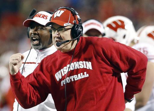 FILE - In this Nov. 7, 2015, file photo, Wisconsin head coach Paul Chryst, foreground, reacts after running back Alec Ingold scored a touchdown in the second half of an NCAA college football game against Maryland. Wisconsin has to play national powers LSU, Michigan State, Michigan and Ohio State in its first six games alone. The Badgers are embracing the challenge in Paul Chryst&#8217;s 2nd season as head coach. (AP Photo/Patrick Semansky, File)