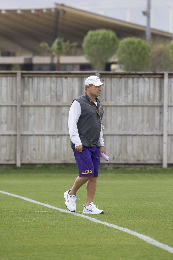 Les Miles walking across field while LSU Football practices in the afternoon on Tuesday, March 29, 2016 at Charles McClendon Practice Facility.