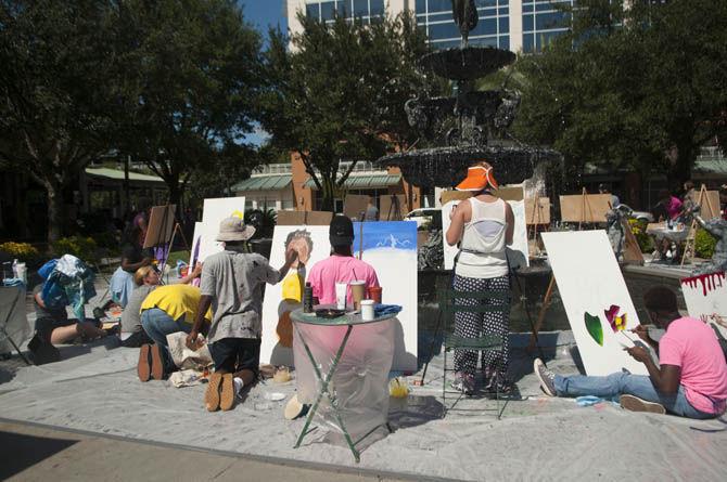 Students members of Les Jeanes Artistes De Louisiane partake in an art battle during the Perkins Rowe's sixth annual arts festival lasting from Saturday, September 12, 2015 to Sunday, September 13, 2015.