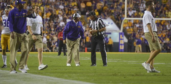 LSU head coach Les Miles argues with head linesman Lane Thomas about a foul call against the Tigers during the 34-13 win against the Jacksonville Gamecocks on Saturday Sept. 10, 2016, in Tiger Stadium.