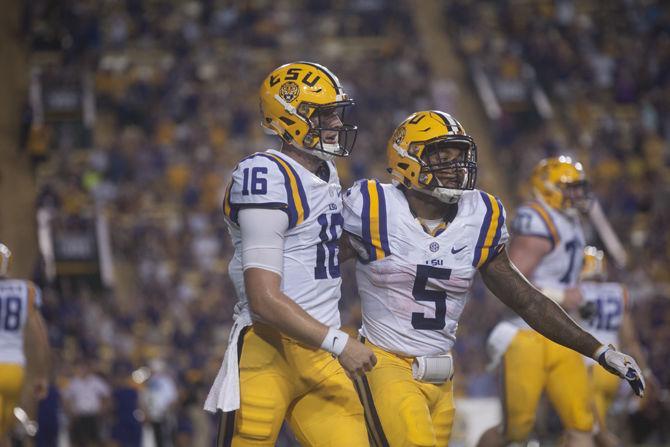 LSU junior quarterback Danny Etling (16) and sophomore running back Derrius Guice (5) celebrate a touchdown on Saturday Sept. 10, 2016 during the Tigers' 34-13 victory over Jacksonville State University.