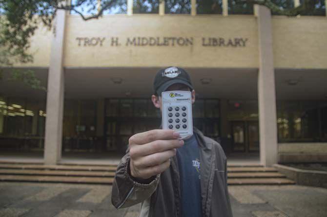 LSU student holds clicker infront of Troy H. Middleton Library where clickers are no longer available for rent on Sept. 5, 2016, on LSU Campus.