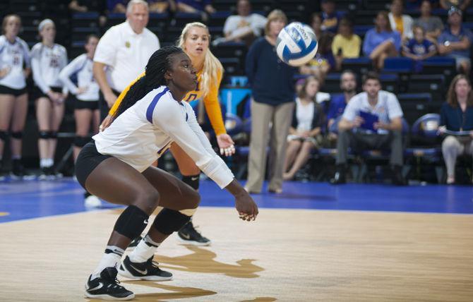 LSU junior outside hitter Gina Tillis (12) digs the ball during the Tigers' 3-1 loss against Southern Miss on Saturday, Sept. 3, 2016 in the Pete Maravich Assembly Center.