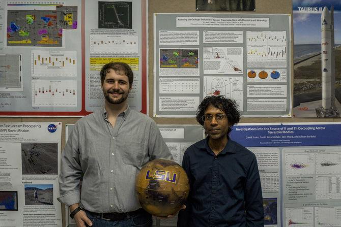 LSU graduate student Don Hood and his advisor Suniti Karunatillake hold LSU Mars globe in the Planetary Science Laboratory of Howe-Russell on Sept. 16, 2016.