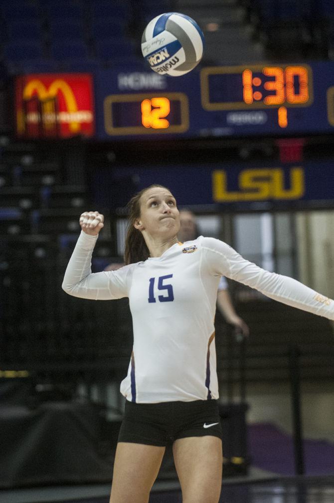 LSU senior defensive specialist Haley Smith (15) serves during the Tigers' 3-2 defeat against The University of Alabama on Sunday Oct. 18, 2015, in the Pete Maravich Assembly Center.