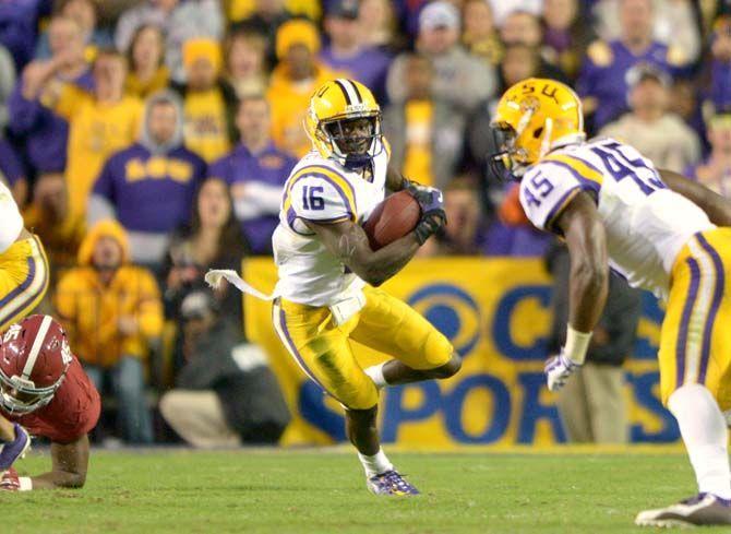 LSU sophomore defensive back Tre'Davious White (16) returns a punt Saturday, Nov. 8, 2014 during the Tigers' 20-13 loss against the Crimson Tide in Tiger Stadium.