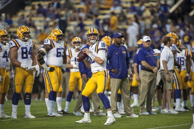 LSU junior quarterback Danny Etling (16) warming up before the Tigers' 34-13 victory against Jacksonville State University on Sept. 10, 2016, in Death Valley.