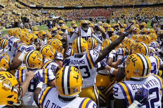 The LSU football team huddles up before taking the field against Auburn on Saturday Sept. 19, 2015, in Tiger Stadium.