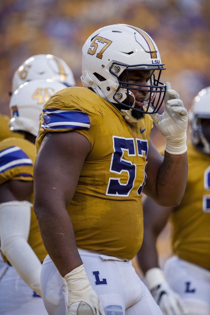 LSU junior defensive end Davon Godchaux (57) prepares for the snap on Sept. 17, 2016 at Tiger Stadium.