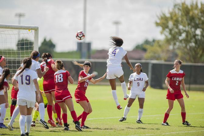 LSU senior forward Summer Clarke (4) heads a ball toward goal during the Lamar game on Sept. 18, 2016 at LSU Soccer Stadium.