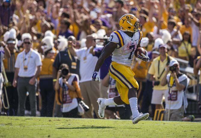 <p>LSU sophomore running back Leonard Fournette (7) scores a touchdown during the Tigers' 45-21 victory against Auburn on Saturday, Sept.19, 2015, in Tiger Stadium.</p>