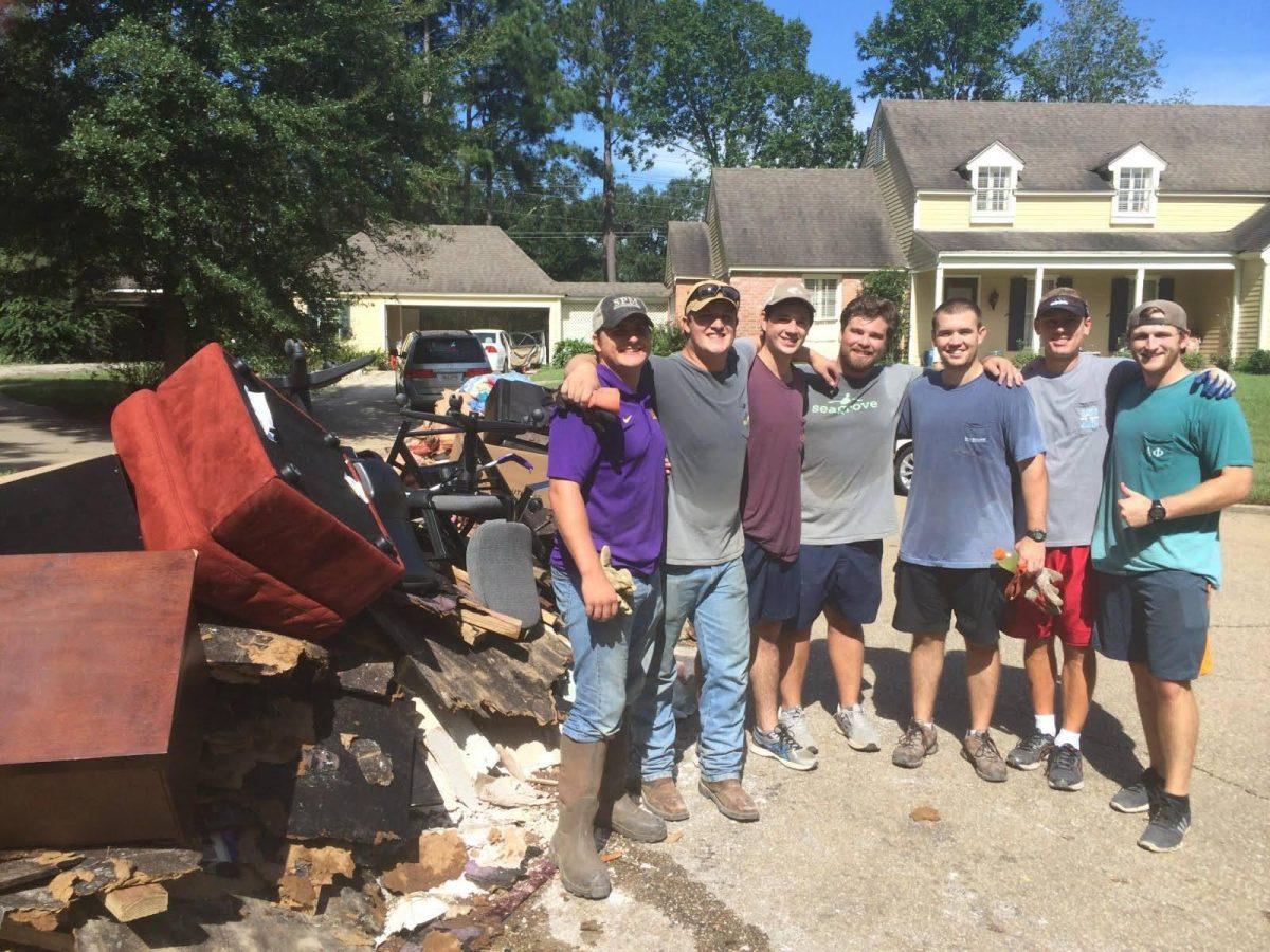 Members of the University's Sigma Phi Epsilon chapter help out with recovery efforts following Louisiana's August flooding.