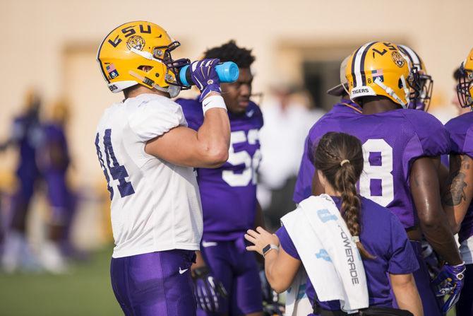 LSU junior fullback J.D. Moore (44) hydrates after a drill during an outdoor practice on Tuesday Sept. 27, 2016, on the LSU footbal practice fields at the LSU Football Practice and Training Facilities.