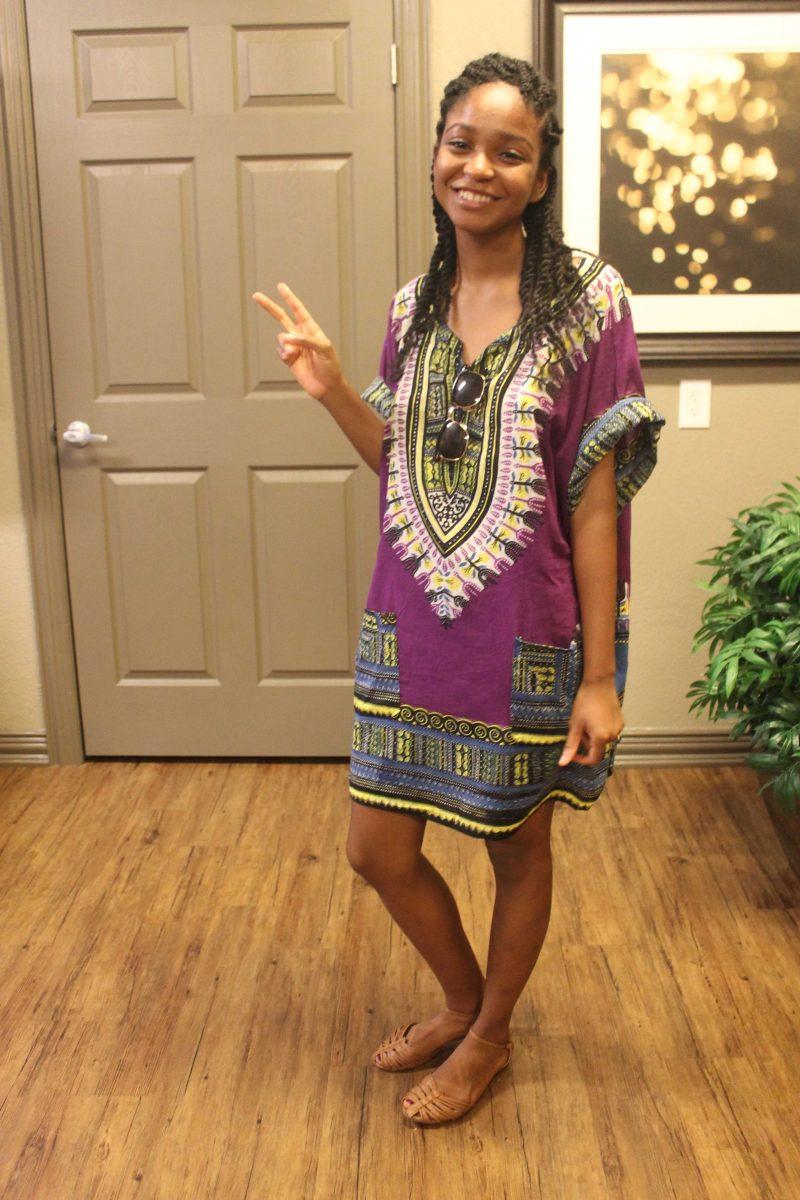 Kinesiology senior Nia Jackson dons a traditional West African Dashiki in place of a typical gameday dress.