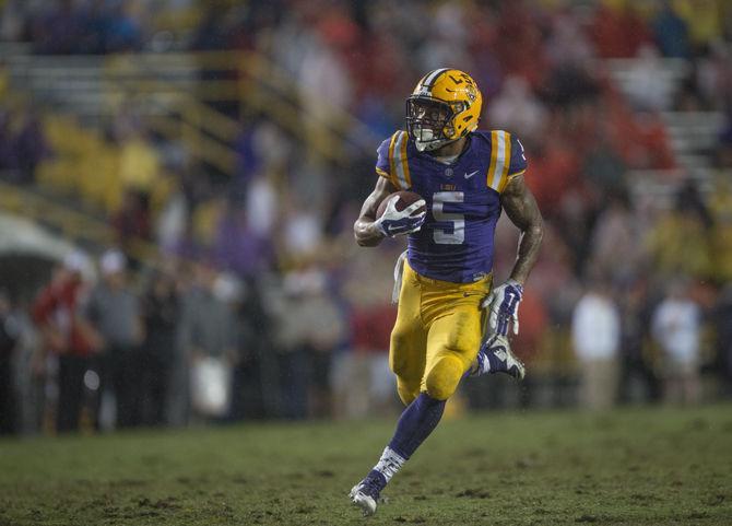 LSU freshman running back Derrius Guice (5) rushes to score a touchdown during the Tigers&#8217; 48- 20 victory against Western Kentucky on Saturday, Oct. 24, 2015 in Tiger Stadium.