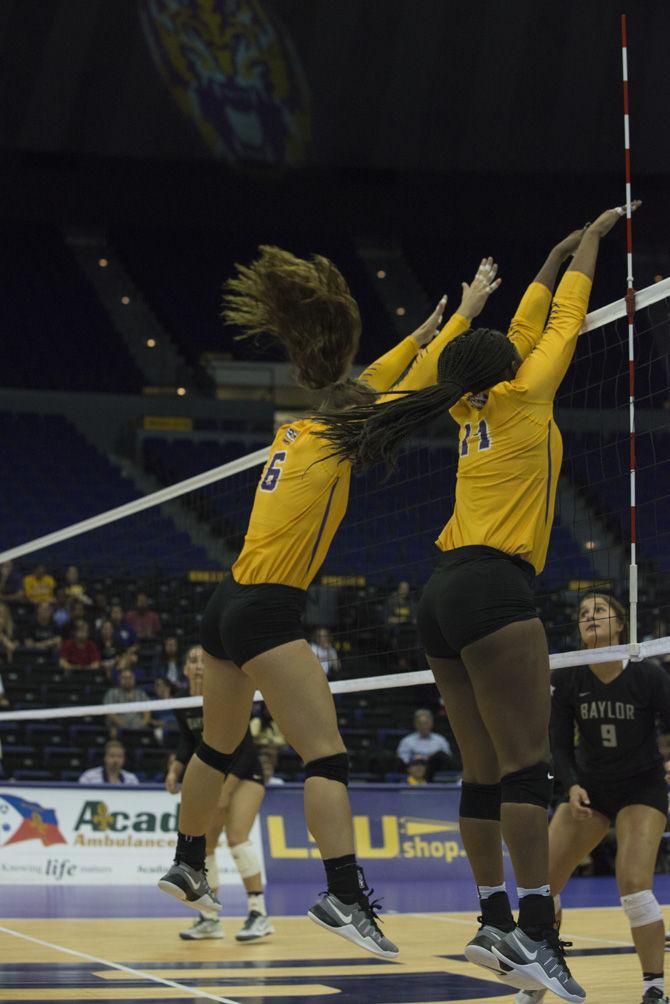 LSU freshman middle blocker Jariel Tureaud (14) and senior middle blocker Tiara Gibson (6) block the ball during the 0-3 loss against Baylor University on wednesday, Sept. 14, 2016 in the Pete Maravich Assembly Center.