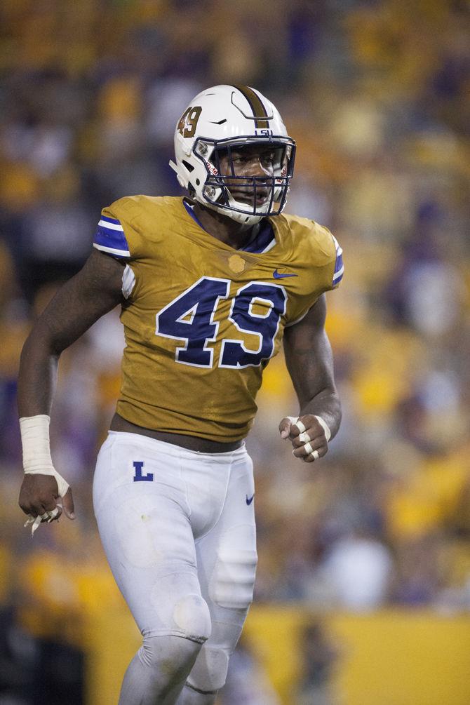 LSU sophomore linebacker Arden Key (49) celebrates after making an important sack during the Tigers' 23-20 victory against Mississippi State on Saturday Sept. 17, 2016, at Tiger Stadium.