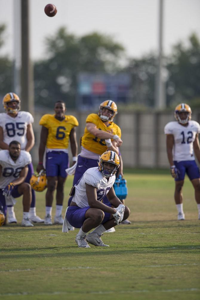 LSU junior quarterback Danny Etling (16) throws a pass over freshman tight end Jamal Pettigrew (80) during an outdoor practice on Tuesday Sept. 27, 2016, on the LSU footbal practice fields at the LSU Football Practice and Training Facilities.