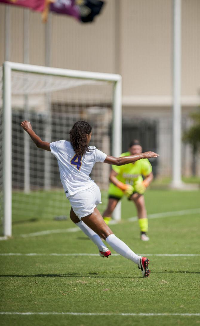 LSU senior forward Summer Clarke (4) sends a cross in during the Lamar game on Sept. 18, 2016 at LSU Soccer Stadium.