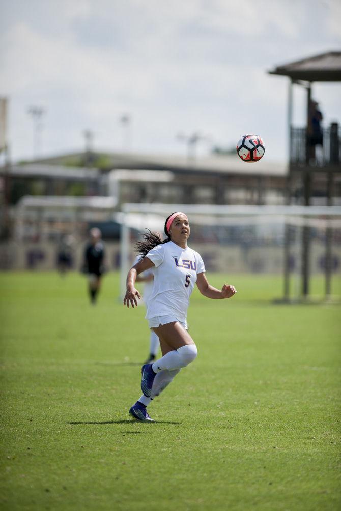 LSU junior forward Jorian Baucom (5) chases down a ball during the Lamar game on Sept. 18, 2016 at LSU Soccer Stadium.