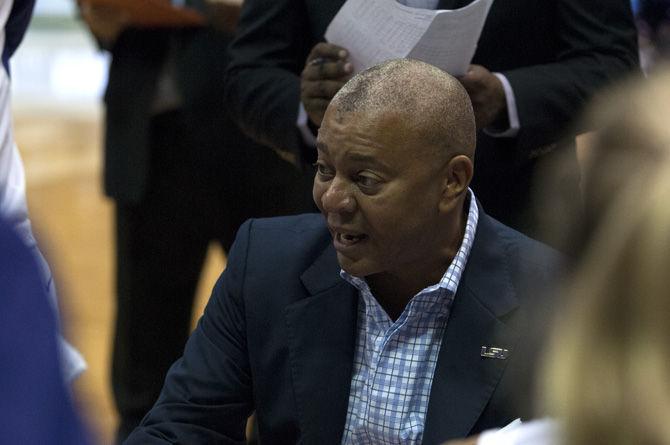 LSU head basketball coach Johnny Jones talks to the team for a time-out during the Tigers' 98-72 victory against Southwest Baptist University on Nov. 6, 2015, in the PMAC.