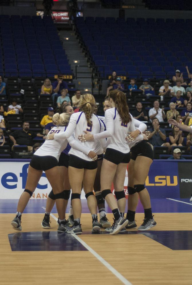 LSU players gather after winning a point during the Tigers' 0-3 loss against the University of Arkansas on September 25, 2016 in the Pete Maravich Assembly Center.