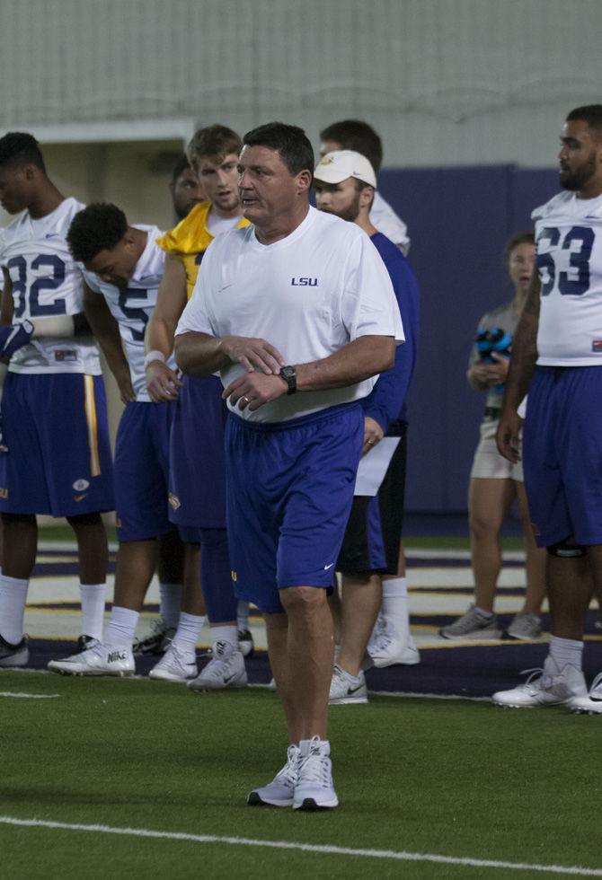 LSU interim head coach Ed Orgeron watches the Tigers' offense run a play on Sept. 26, 2016 at the Indoor Football Facility.