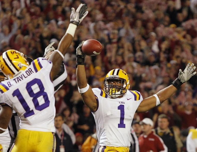 LSU safety Eric Reid (1) celebrates with safety Brandon Taylor after intercepting the ball from Alabama during the second half of an NCAA college football game Saturday, Nov. 5, 2011, in Tuscaloosa, Ala. LSU won 9-6. (AP Photo/Dave Martin)