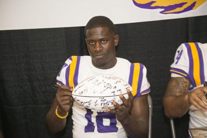 LSU junior Tre&#8217;Davious White (18) signs autographs during fan day on Sunday, Aug. 16, 2015 at the Carl Maddox Field House.