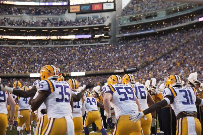 Members of the LSU football team run out onto the field before the 42-7 victory against Missouri on Saturday, Oct. 1, 2016 at Tiger Stadium.