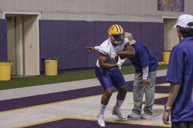 LSU junior Leonard Fournette (7) performs a drill during the Tigers' spring practice session on Tuesday, Mar. 8, 2016 in the Football Operations Center.