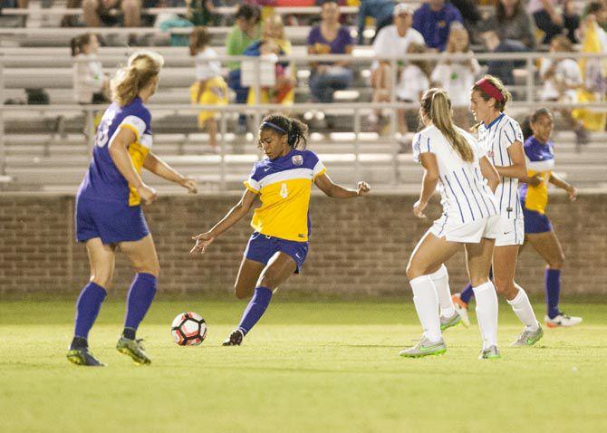 LSU senior forward Summer Clarke (4) kicks the ball up field during Tiger's (3-0) loss against University of Florida on Sept. 30, 2016 at LSU.