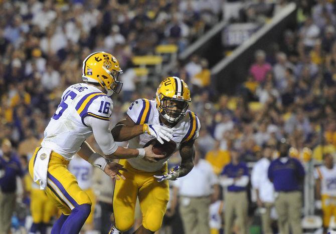 LSU junior quarterback Danny Etling (16) hands the ball off to sophomore running back Derrius Guice (5) on Saturday, Oct. 1, 2016, during the Tigers' 42-7 victory against Missouri in Tiger Stadium.