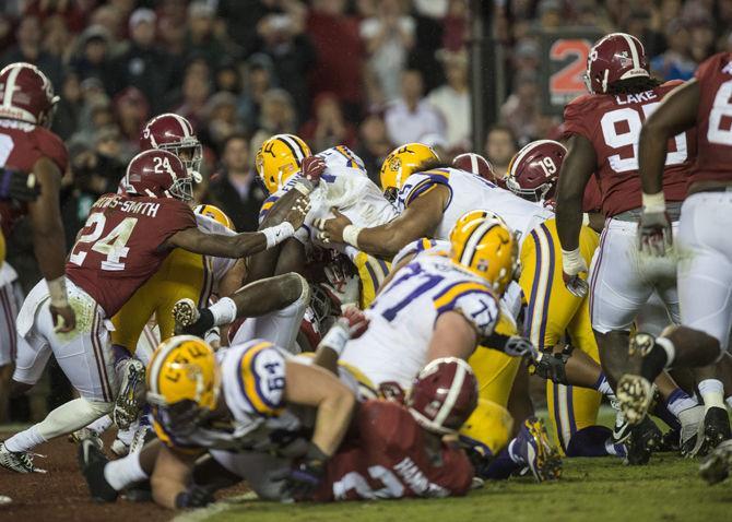 LSU sophomore running back Leonard Fournette (7) scores a touchdown during the Tigers' 30-16 defeat against The University of Alabama on Saturday, Nov. 7, 2015 in the Bryant-Denny Stadium.