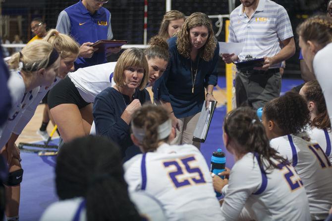 LSU volleyball head coach Fran Flory strategizes with players during the Tigers' 3-1 loss against Southern Miss on Saturday, Sept. 3, 2016 in the Pete Maravich Assembly Center.