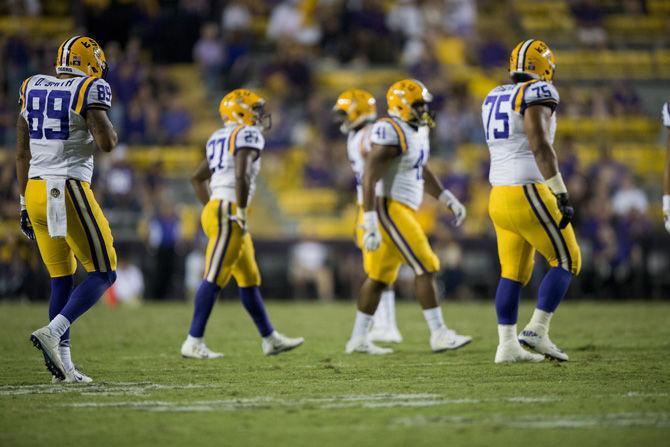 LSU senior tight end DeSean Smith (89) and sophomore offensive guard Maea Teuhema (75) walks on to field from side line during the 42-7 victory against Missouri on Saturday, Oct. 1, 2016 at Tiger Stadium.